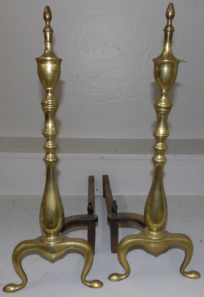 Pair of Cast Brass Andirons: Pair of Cast Brass Andirons . 21 3/4" H ALL DESCRIPTIONS AND ANY CONDITION STATEMENT GIVEN BY LANGSTON AUCTION GALLERY ARE STRICTLY OPINIONS AND LANGSTON'S SHALL HAVE NO RESPONSIBILITY FOR ERRORS OR O