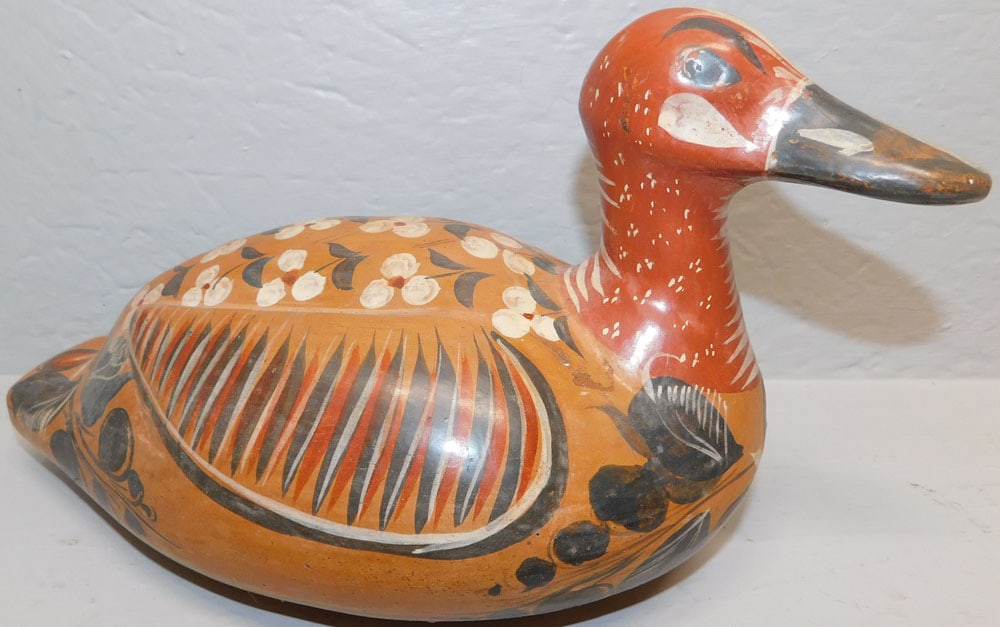 Painted Pottery Duck: Painted Pottery Duck. 13 1/2" L ALL DESCRIPTIONS AND ANY CONDITION STATEMENT GIVEN BY LANGSTON AUCTION GALLERY ARE STRICTLY OPINIONS AND LANGSTON'S SHALL HAVE NO RESPONSIBILITY FOR ERRORS OR OMISSIONS