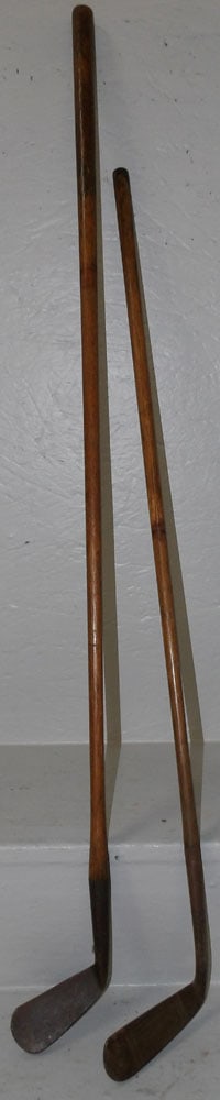 Two Antique Golf Clubs: Two Antique Golf Clubs. 39 1/4" H ALL DESCRIPTIONS AND ANY CONDITION STATEMENT GIVEN BY LANGSTON AUCTION GALLERY ARE STRICTLY OPINIONS AND LANGSTON'S SHALL HAVE NO RESPONSIBILITY FOR ERRORS OR OMISSIO