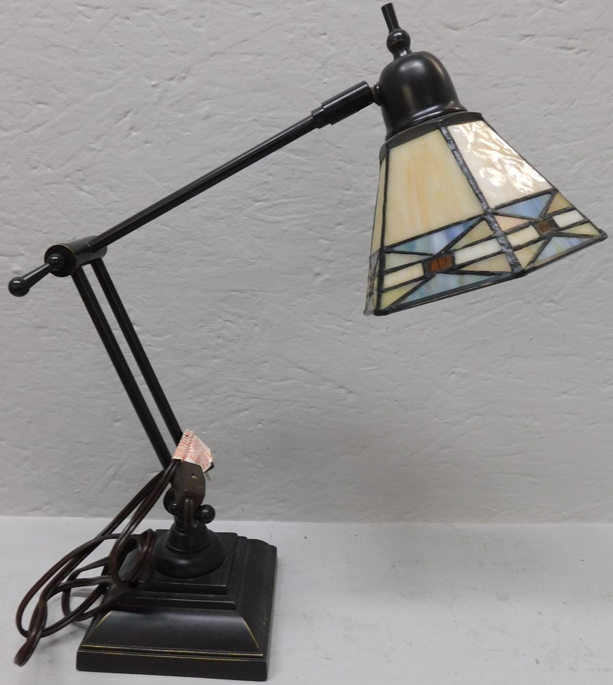 Adjustable Leaded Stained Glass Shade Desk Lamp: Adjustable Leaded Stained Glass Shade Desk Lamp. 16" H ALL DESCRIPTIONS AND ANY CONDITION STATEMENT GIVEN BY LANGSTON AUCTION GALLERY ARE STRICTLY OPINIONS AND LANGSTON'S SHALL HAVE NO RESPONSIBILITY 