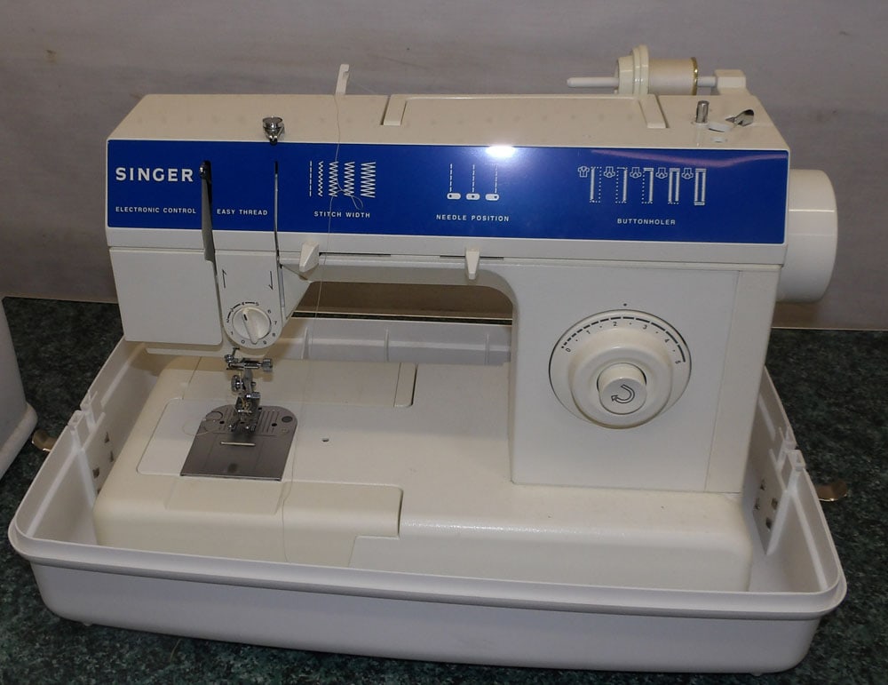 Sewing Machine in Box: Sewing Machine in Box. 20" W 10 1/2" D 15" H ALL DESCRIPTIONS AND ANY CONDITION STATEMENT GIVEN BY LANGSTON AUCTION GALLERY ARE STRICTLY OPINIONS AND LANGSTON'S SHALL HAVE NO RESPONSIBILITY FOR ERRORS