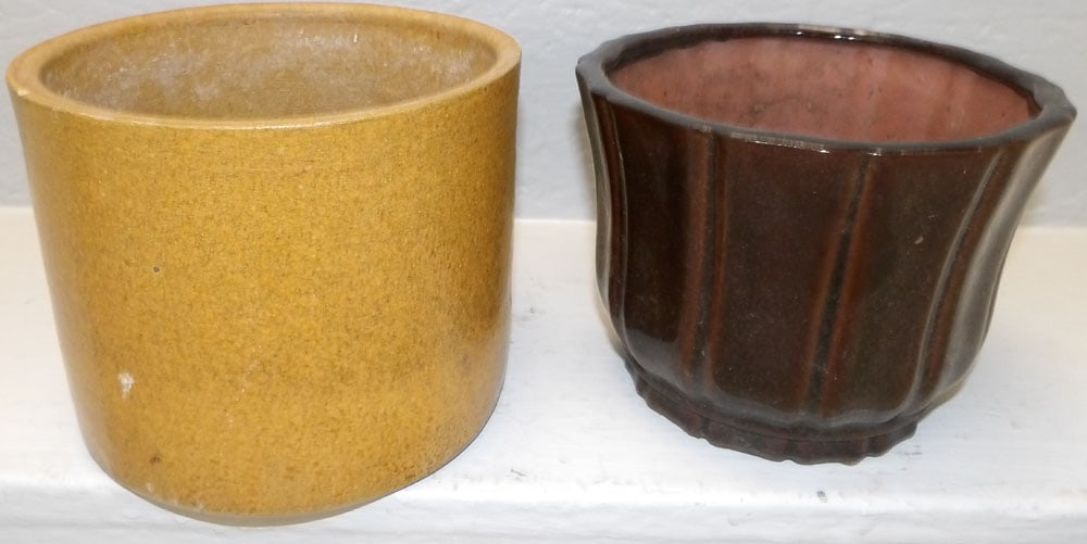 one stoneware and one pottery planter: one stoneware and one pottery planter. Up to 7 1/4" Dia. 5 3/4" H ALL DESCRIPTIONS AND ANY CONDITION STATEMENT GIVEN BY LANGSTON AUCTION GALLERY ARE STRICTLY OPINIONS AND LANGSTON'S SHALL HAVE NO RESP