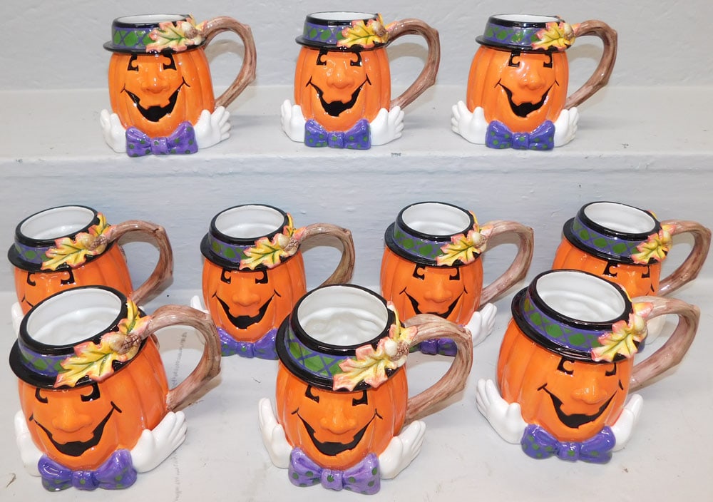 lot of painted porcelain Fitz & Floyd mugs: lot of painted porcelain Fitz & Floyd mugs. ALL DESCRIPTIONS AND ANY CONDITION STATEMENT GIVEN BY LANGSTON AUCTION GALLERY ARE STRICTLY OPINIONS AND LANGSTON'S SHALL HAVE NO RESPONSIBILITY FOR ERRORS