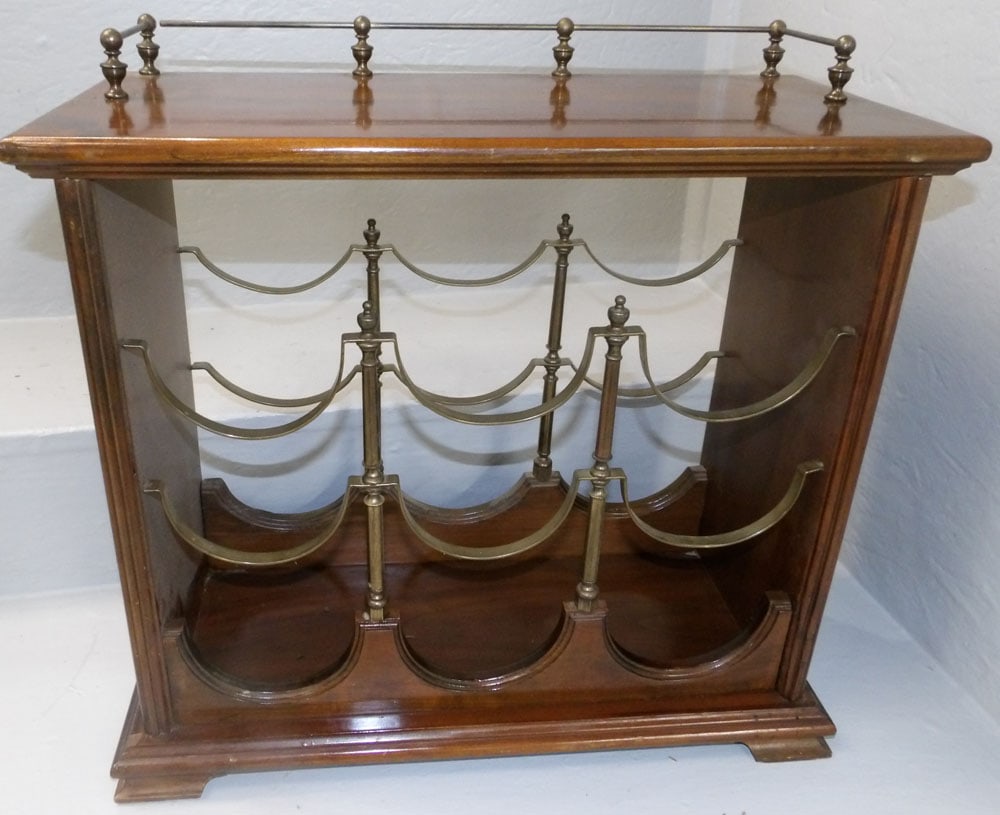 cherry and brass wine rack: cherry and brass wine rack. 18 1/2" W 8 3/4" D 17 1/2" H ALL DESCRIPTIONS AND ANY CONDITION STATEMENT GIVEN BY LANGSTON AUCTION GALLERY ARE STRICTLY OPINIONS AND LANGSTON'S SHALL HAVE NO RESPONSIBILIT