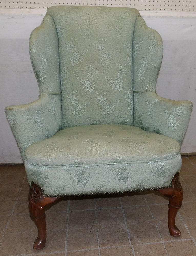 bench made carved walnut wing back chair: bench made carved walnut wing back chair. 43" H ALL DESCRIPTIONS AND ANY CONDITION STATEMENT GIVEN BY LANGSTON AUCTION GALLERY ARE STRICTLY OPINIONS AND LANGSTON'S SHALL HAVE NO RESPONSIBILITY FOR ERR