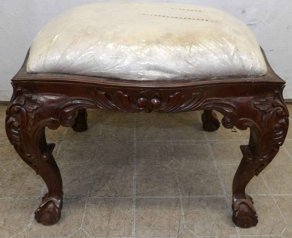Carved Mahogany Ottoman: Carved Mahogany Ottoman. 26" W 21 3/4" D 20 1/2" H ALL DESCRIPTIONS AND ANY CONDITION STATEMENT GIVEN BY LANGSTON AUCTION GALLERY ARE STRICTLY OPINIONS AND LANGSTON'S SHALL HAVE NO RESPONSIBILITY FOR 