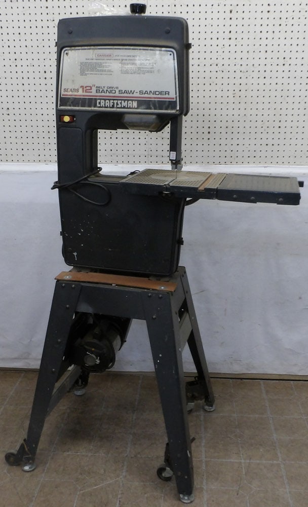 12" craftsman band saw: 12" craftsman band saw . 66" H ALL DESCRIPTIONS AND ANY CONDITION STATEMENT GIVEN BY LANGSTON AUCTION GALLERY ARE STRICTLY OPINIONS AND LANGSTON'S SHALL HAVE NO RESPONSIBILITY FOR ERRORS OR OMISSIONS.