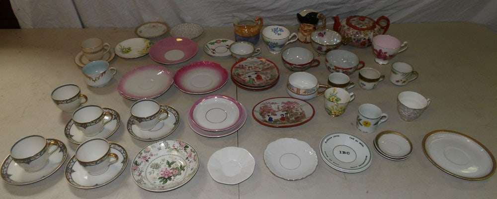 Lot of Porcelain Teapots, Cups & Saucers: Lot of Porcelain Teapots, Cups & Saucers. "ALL DESCRIPTIONS AND ANY CONDITION STATEMENT GIVEN BY LANGSTON AUCTION GALLERY ARE STRICTLY OPINIONS AND LANGSTON'S SHALL HAVE NO RESPONSIBILITY FOR ERRORS O