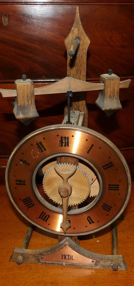 Baumann Swiss Wood Clock: Baumann Swiss Wood Clock. 15" H "ALL DESCRIPTIONS AND ANY CONDITION STATEMENT GIVEN BY LANGSTON AUCTION GALLERY ARE STRICTLY OPINIONS AND LANGSTON'S SHALL HAVE NO RESPONSIBILITY FOR ERRORS OR OMISSION