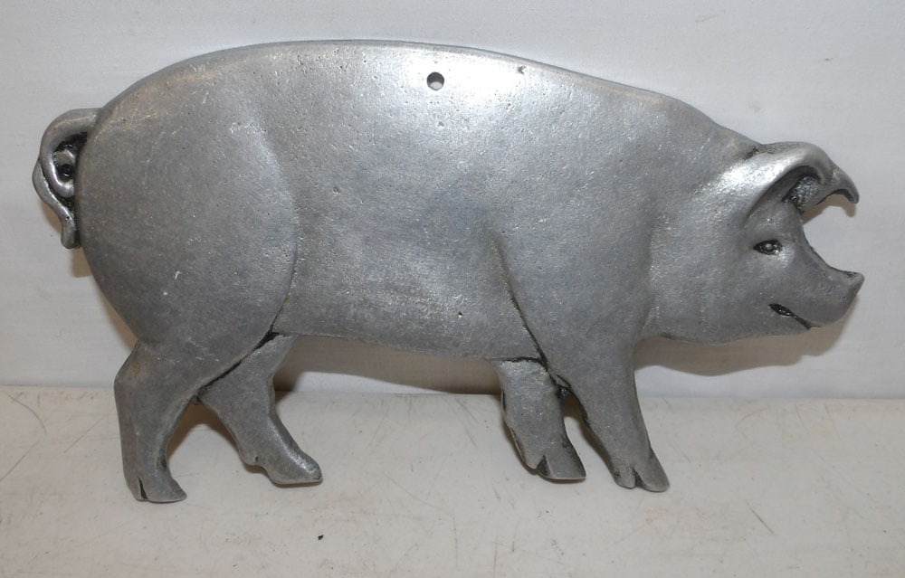 Cast Aluminum Wall Pig: Cast Aluminum Wall Pig. 9" W 5 3/4" H "ALL DESCRIPTIONS AND ANY CONDITION STATEMENT GIVEN BY LANGSTON AUCTION GALLERY ARE STRICTLY OPINIONS AND LANGSTON'S SHALL HAVE NO RESPONSIBILITY FOR ERRORS OR OM