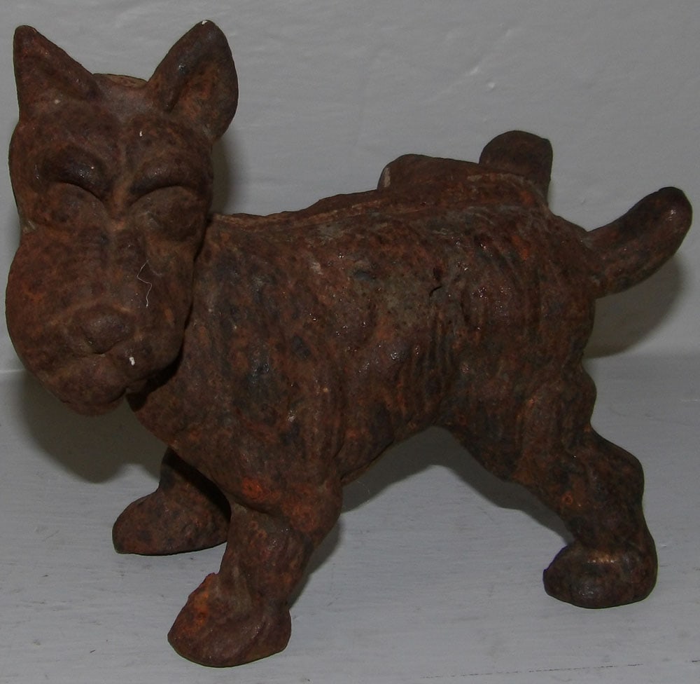 Cast Iron Scottish Terrier Door Stop: Cast Iron Scottish Terrier Door Stop . 6 1/2" L 6" H "ALL DESCRIPTIONS AND ANY CONDITION STATEMENT GIVEN BY LANGSTON AUCTION GALLERY ARE STRICTLY OPINIONS AND LANGSTON'S SHALL HAVE NO RESPONSIBILITY F