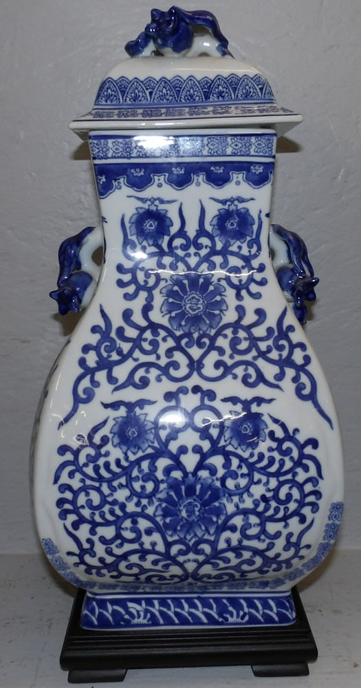 oriental blue and white porcelain urn on wood stand: oriental blue and white porcelain urn on wood stand . 18 1/2" H