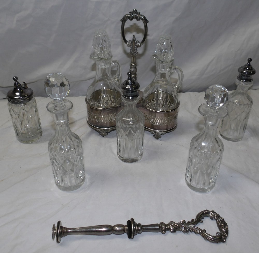 lot of cut glass bottles and cruet stand: lot of cut glass bottles and cruet stand. ALL DESCRIPTIONS AND ANY CONDITION STATEMENT GIVEN BY LANGSTON AUCTION GALLERY ARE STRICTLY OPINIONS AND LANGSTON'S SHALL HAVE NO RESPONSIBILITY FOR ERRORS OR