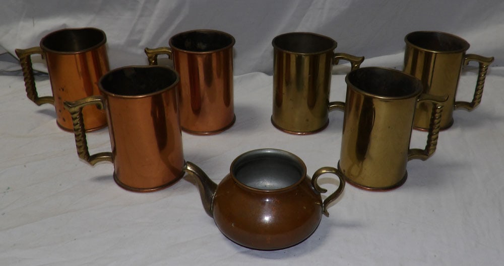 lot of copper and brass mugs: lot of copper and brass mugs. ALL DESCRIPTIONS AND ANY CONDITION STATEMENT GIVEN BY LANGSTON AUCTION GALLERY ARE STRICTLY OPINIONS AND LANGSTON'S SHALL HAVE NO RESPONSIBILITY FOR ERRORS OR OMISSIONS. 