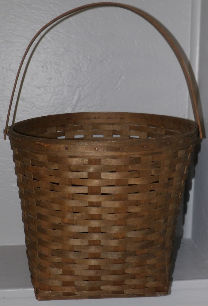 vintage basket: vintage basket. 12 1/2" H ALL DESCRIPTIONS AND ANY CONDITION STATEMENT GIVEN BY LANGSTON AUCTION GALLERY ARE STRICTLY OPINIONS AND LANGSTON'S SHALL HAVE NO RESPONSIBILITY FOR ERRORS OR OMISSIONS. THE 