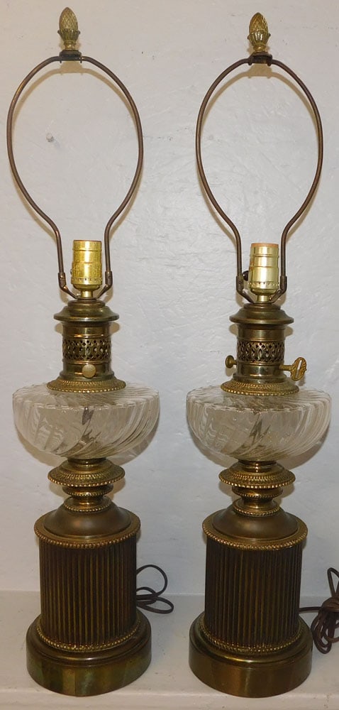 pair gilded metal and glass lamps: pair gilded metal and glass lamps. 29 1/2" H ALL DESCRIPTIONS AND ANY CONDITION STATEMENT GIVEN BY LANGSTON AUCTION GALLERY ARE STRICTLY OPINIONS AND LANGSTON'S SHALL HAVE NO RESPONSIBILITY FOR ERRORS