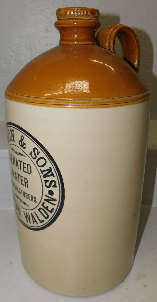 stoneware whiskey jug: stoneware whiskey jug. 17"H ALL DESCRIPTIONS AND ANY CONDITION STATEMENT GIVEN BY LANGSTON AUCTION GALLERY ARE STRICTLY OPINIONS AND LANGSTON'S SHALL HAVE NO RESPONSIBILITY FOR ERRORS OR OMISSIONS. TH