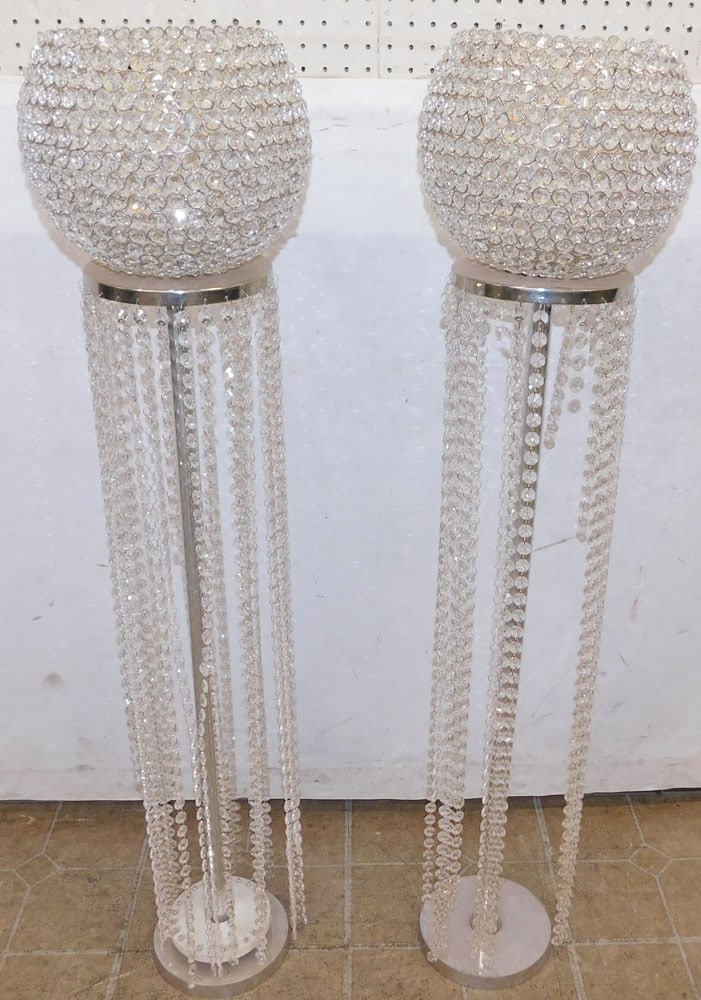pair of aluminum and crystal beaded candle holders: pair of aluminum and crystal beaded candle holders. 44 1/2 H ALL DESCRIPTIONS AND ANY CONDITION STATEMENT GIVEN BY LANGSTON AUCTION GALLERY ARE STRICTLY OPINIONS AND LANGSTON'S SHALL HAVE NO RESPONSIB