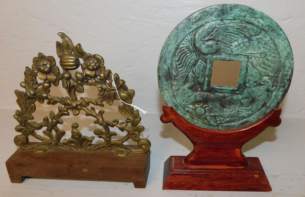 two oriental bronze plaques on wood stand (1 of 3)