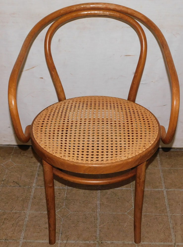 bentwood and cane seat arm chair: bentwood and cane seat arm chair. 32" H ALL DESCRIPTIONS AND ANY CONDITION STATEMENT GIVEN BY LANGSTON AUCTION GALLERY ARE STRICTLY OPINIONS AND LANGSTON'S SHALL HAVE NO RESPONSIBILITY FOR ERRORS OR O