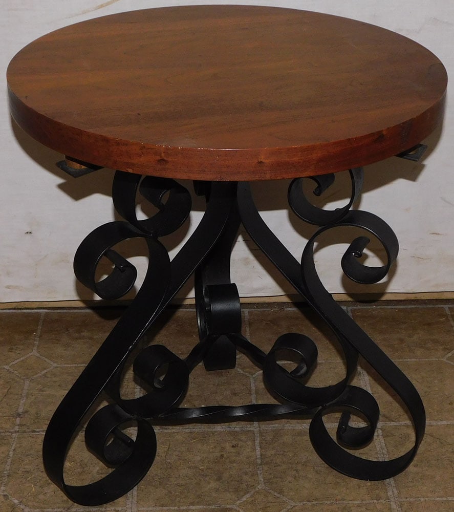 walnut and wrought iron base stand: walnut and wrought iron base stand. 17 3/4" Dia. 19 1/4" H ALL DESCRIPTIONS AND ANY CONDITION STATEMENT GIVEN BY LANGSTON AUCTION GALLERY ARE STRICTLY OPINIONS AND LANGSTON'S SHALL HAVE NO RESPONSIBIL