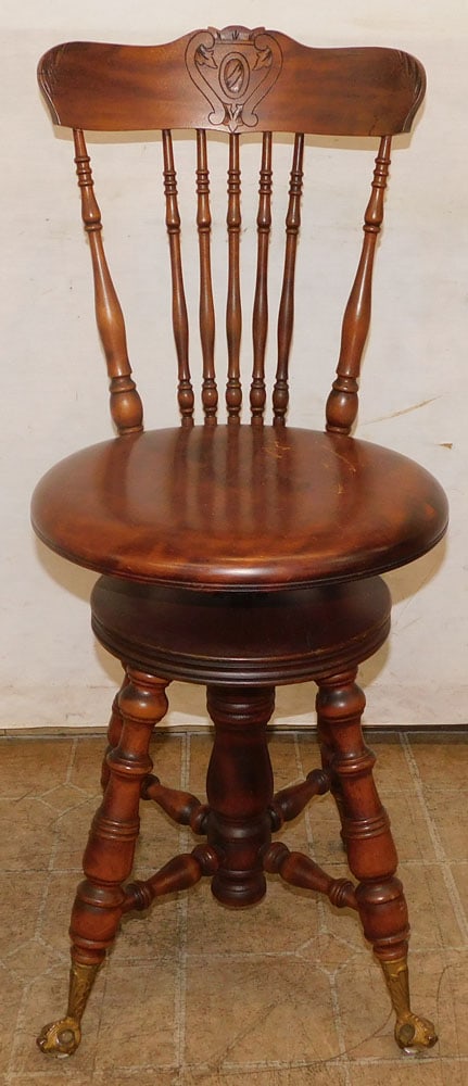 antique mahogany revolving piano stool: antique mahogany revolving piano stool . 35 1/2" H ALL DESCRIPTIONS AND ANY CONDITION STATEMENT GIVEN BY LANGSTON AUCTION GALLERY ARE STRICTLY OPINIONS AND LANGSTON'S SHALL HAVE NO RESPONSIBILITY FOR