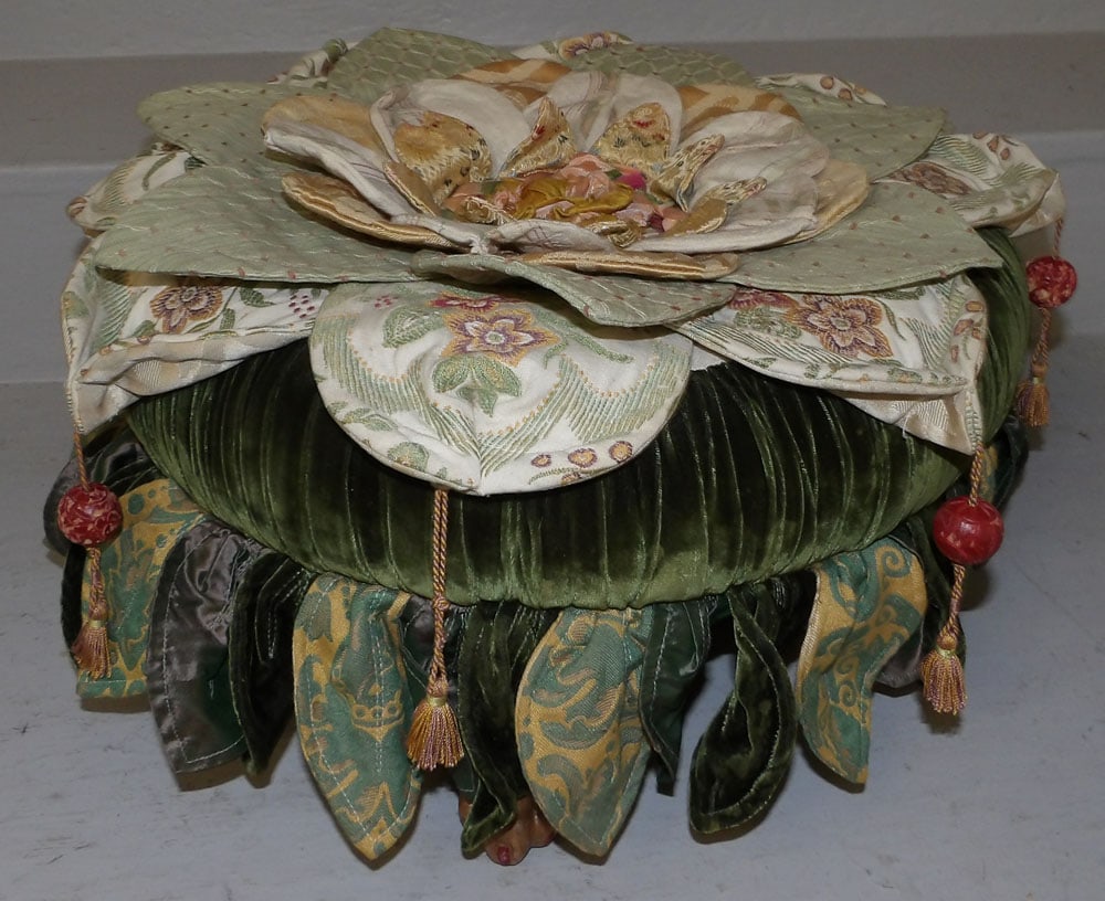 upholstered foot stool: upholstered foot stool. 17" Dia. 9 1/4" H ALL DESCRIPTIONS AND ANY CONDITION STATEMENT GIVEN BY LANGSTON AUCTION GALLERY ARE STRICTLY OPINIONS AND LANGSTON'S SHALL HAVE NO RESPONSIBILITY FOR ERRORS OR