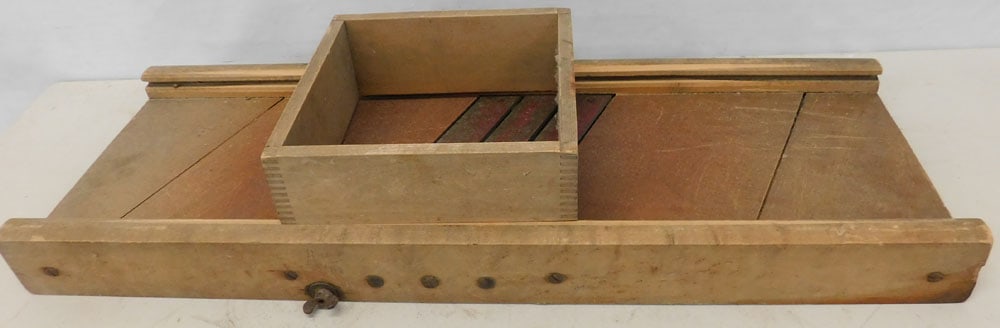 antique primitive slicer: antique primitive slicer. 30"L ALL DESCRIPTIONS AND ANY CONDITION STATEMENT GIVEN BY LANGSTON AUCTION GALLERY ARE STRICTLY OPINIONS AND LANGSTON'S SHALL HAVE NO RESPONSIBILITY FOR ERRORS OR OMISSIONS.