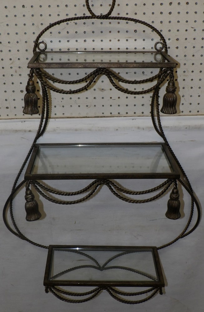 painted metal and glass wall shelf: painted metal and glass wall shelf. 25" W 10" D 38" H ALL DESCRIPTIONS AND ANY CONDITION STATEMENT GIVEN BY LANGSTON AUCTION GALLERY ARE STRICTLY OPINIONS AND LANGSTON'S SHALL HAVE NO RESPONSIBILITY F