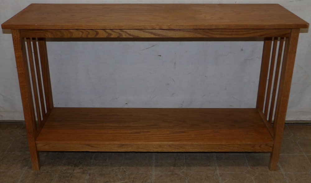 oak mission style console: oak mission style console. 47 1/2" W 16" D 28" H ALL DESCRIPTIONS AND ANY CONDITION STATEMENT GIVEN BY LANGSTON AUCTION GALLERY ARE STRICTLY OPINIONS AND LANGSTON'S SHALL HAVE NO RESPONSIBILITY FOR ER