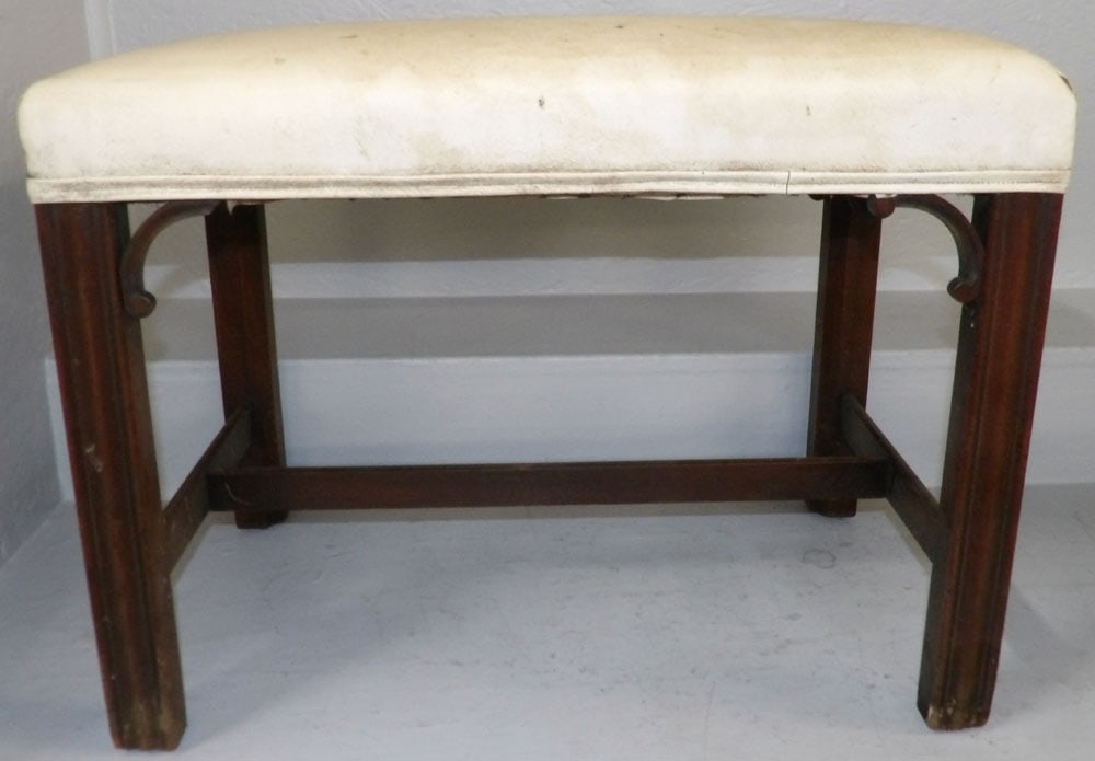 mahogany vinyl upholstered top bench: mahogany vinyl upholstered top bench. 24" W 15" D 18" H ALL DESCRIPTIONS AND ANY CONDITION STATEMENT GIVEN BY LANGSTON AUCTION GALLERY ARE STRICTLY OPINIONS AND LANGSTON'S SHALL HAVE NO RESPONSIBILITY