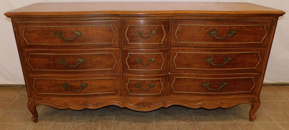 walnut French provincial dresser: walnut French provincial dresser. 67 1/2" W 21" D 32 1/4" H ALL DESCRIPTIONS AND ANY CONDITION STATEMENT GIVEN BY LANGSTON AUCTION GALLERY ARE STRICTLY OPINIONS AND LANGSTON'S SHALL HAVE NO RESPONSIBI