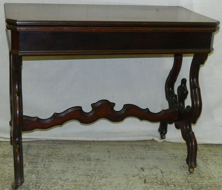 Victorian walnut fold over game table.: Victorian walnut fold over game table. 36" wide x 18" deep x 30" tall.