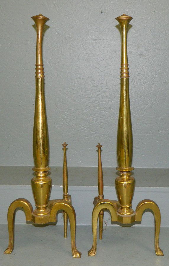 Pair of tall brass andirons to fit in front of gas: Pair of tall brass andirons to fit in front of gas logs. 28 1/2" tall.
