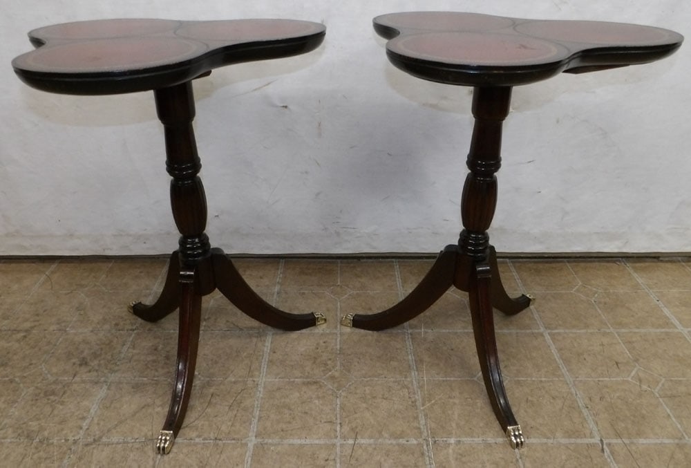 pair of mahogany and tooled leather top candlestands: pair of mahogany and tooled leather top candlestands. 20" Dia. 25 1/2" H "ALL DESCRIPTIONS AND ANY CONDITION STATEMENT GIVEN BY LANGSTON AUCTION GALLERY ARE STRICTLY OPINIONS AND LANGSTON'S SHALL HAVE