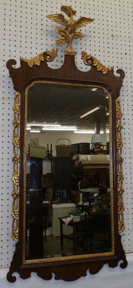 mahogany and gilded frame Phoenix crest bevel mirror: mahogany and gilded frame Phoenix crest bevel mirror. 22" x 50 1/4" "ALL DESCRIPTIONS AND ANY CONDITION STATEMENT GIVEN BY LANGSTON AUCTION GALLERY ARE STRICTLY OPINIONS AND LANGSTON'S SHALL HAVE NO R