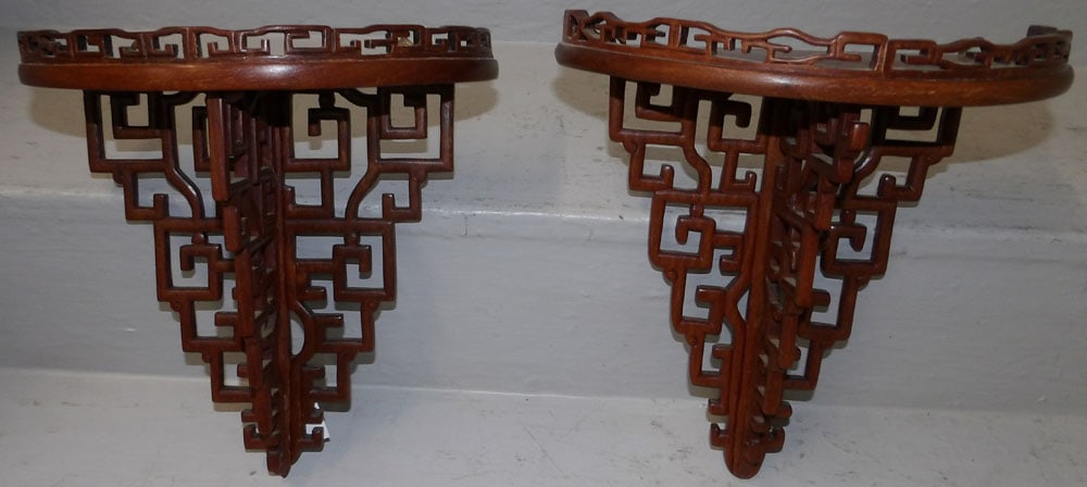 pair of Oriental rosewood wall brackets: pair of Oriental rosewood wall brackets. 10 1/4" W 11" H "ALL DESCRIPTIONS AND ANY CONDITION STATEMENT GIVEN BY LANGSTON AUCTION GALLERY ARE STRICTLY OPINIONS AND LANGSTON'S SHALL HAVE NO RESPONSIBILI