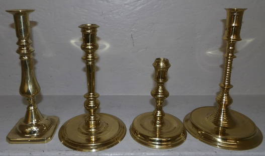 four brass Virginia Metalcrafters candlesticks: four brass Virginia Metalcrafters candlesticks. Up to 9" H "ALL DESCRIPTIONS AND ANY CONDITION STATEMENT GIVEN BY LANGSTON AUCTION GALLERY ARE STRICTLY OPINIONS AND LANGSTON'S SHALL HAVE NO RESPONSIBI