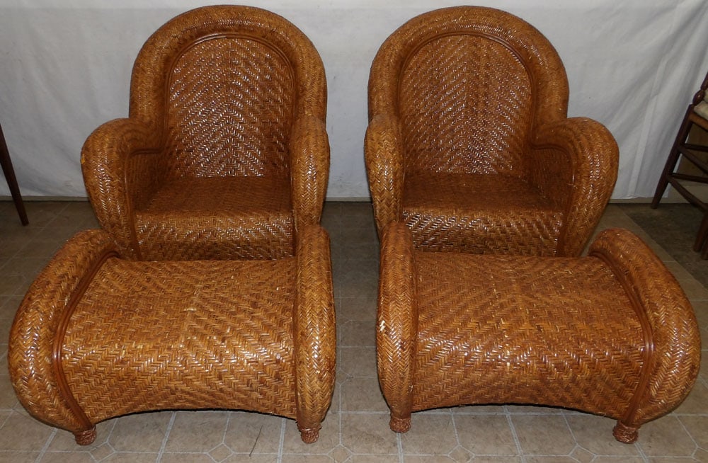 pair of Rattan club chairs with ottomans: pair of Rattan club chairs with ottomans. 36 1/4" H "ALL DESCRIPTIONS AND ANY CONDITION STATEMENT GIVEN BY LANGSTON AUCTION GALLERY ARE STRICTLY OPINIONS AND LANGSTON'S SHALL HAVE NO RESPONSIBILITY FO