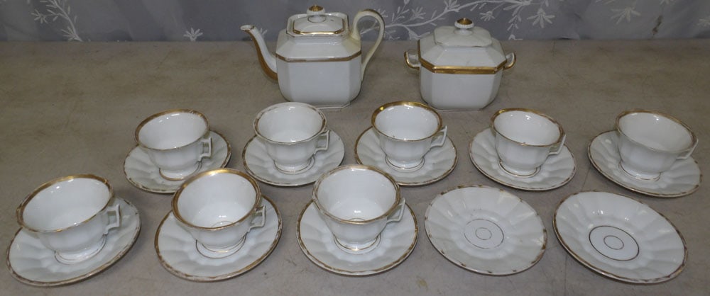 porcelain tea set: porcelain tea set. "ALL DESCRIPTIONS AND ANY CONDITION STATEMENT GIVEN BY LANGSTON AUCTION GALLERY ARE STRICTLY OPINIONS AND LANGSTON'S SHALL HAVE NO RESPONSIBILITY FOR ERRORS OR OMISSIONS. THE ABSENC
