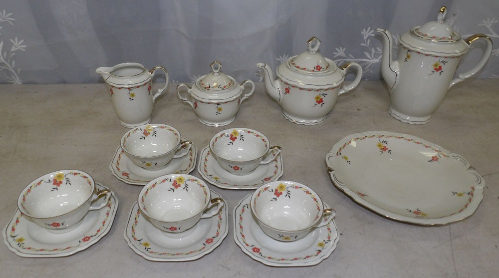 porcelain tea set: porcelain tea set. "ALL DESCRIPTIONS AND ANY CONDITION STATEMENT GIVEN BY LANGSTON AUCTION GALLERY ARE STRICTLY OPINIONS AND LANGSTON'S SHALL HAVE NO RESPONSIBILITY FOR ERRORS OR OMISSIONS. THE ABSENC