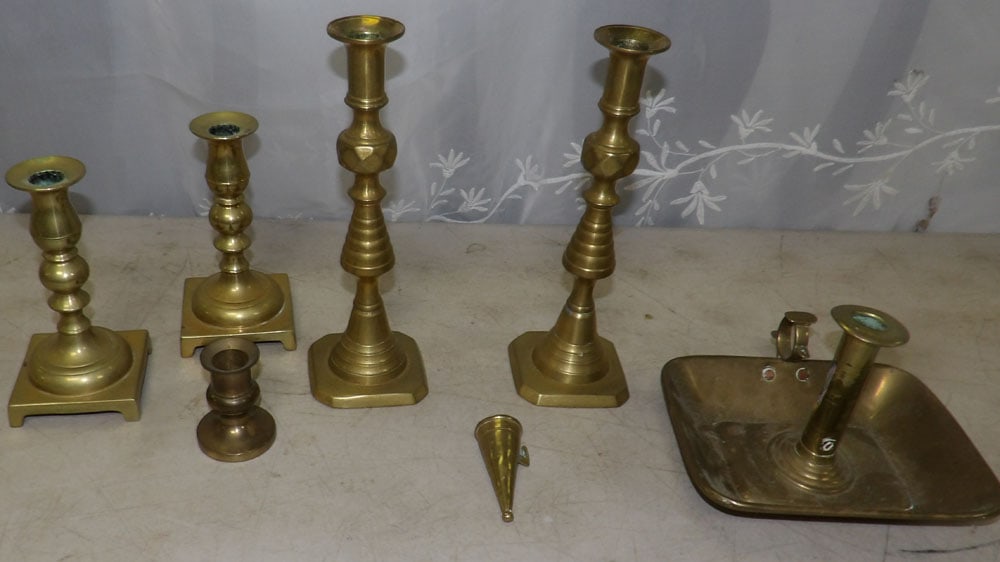 lot of brass candlesticks: lot of brass candlesticks . "ALL DESCRIPTIONS AND ANY CONDITION STATEMENT GIVEN BY LANGSTON AUCTION GALLERY ARE STRICTLY OPINIONS AND LANGSTON'S SHALL HAVE NO RESPONSIBILITY FOR ERRORS OR OMISSIONS. T