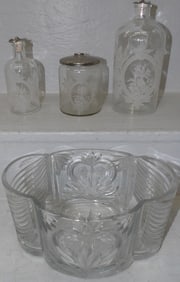 lot of glass bottles and bowl