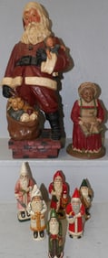 lot of ceramic and resin Santa Claus figurines