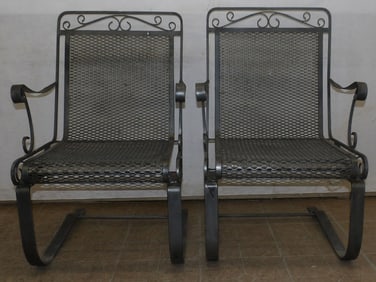 pair of painted wrought iron arm chairs