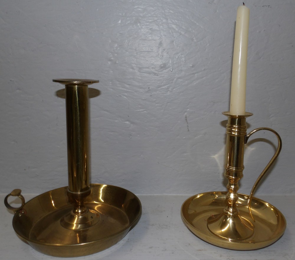 2 brass saucer candlesticks: 2 brass saucer candlesticks. 9 1/4" H "ALL DESCRIPTIONS AND ANY CONDITION STATEMENT GIVEN BY LANGSTON AUCTION GALLERY ARE STRICTLY OPINIONS AND LANGSTON'S SHALL HAVE NO RESPONSIBILITY FOR ERRORS OR OM