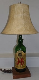 green glass bottle made into lamp
