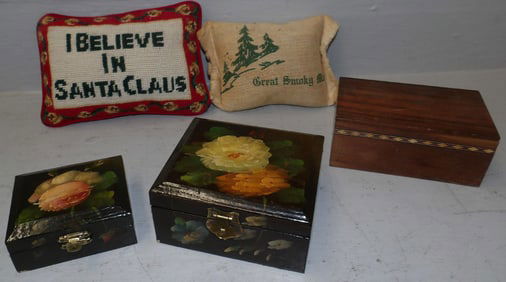 lot of painted wood boxes and needlepoint pillows