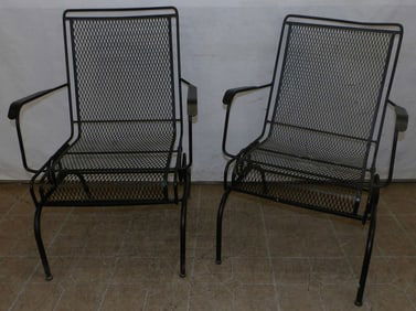 pair of painted wrought iron arm chairs