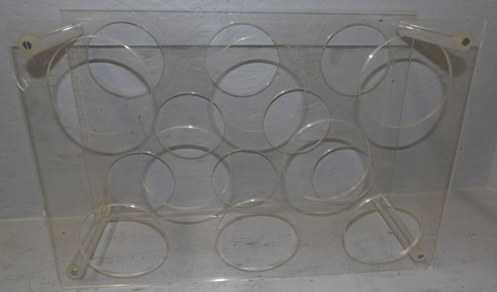 Mid Century Modern Acrylic Wine Rack: Mid Century Modern Acrylic Wine Rack. 18" x 12" "ALL DESCRIPTIONS AND ANY CONDITION STATEMENT GIVEN BY LANGSTON AUCTION GALLERY ARE STRICTLY OPINIONS AND LANGSTON'S SHALL HAVE NO RESPONSIBILITY FOR ER